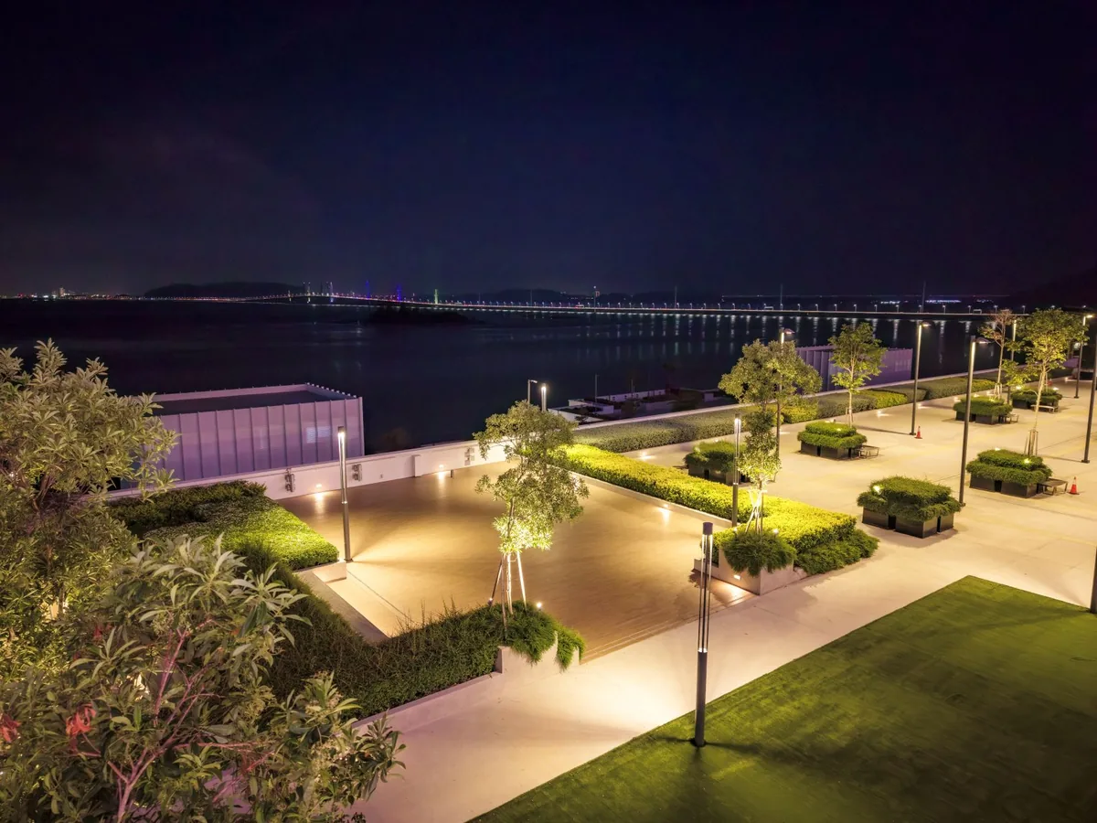 Actual waterfront evening scene with Penang Bridge lights beside PWCC